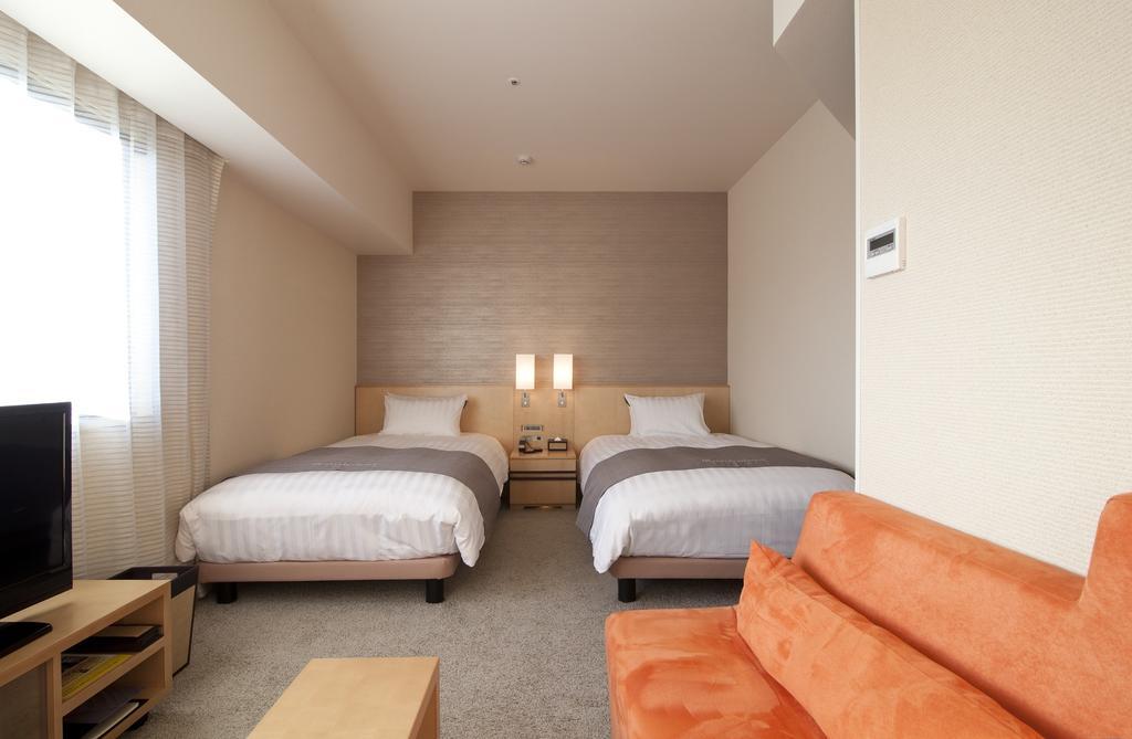 Cocochee Hotel Numazu Rum bild